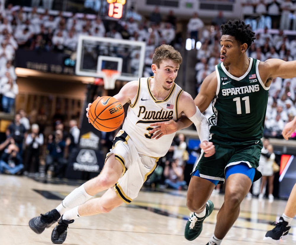 <p>Junior guard A.J. Hoggard (11) guards Purdue's freshman guard Braden Smith (3) during a game against Purdue at Mackey Arena on Jan. 29, 2023. The Spartans lost to the Boilermakers 77-61.</p>