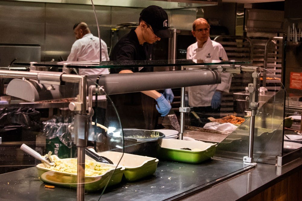 <p>Vegan and vegetarian options are prepared at &quot;Veg Out&quot; at Case Dining Hall on Sept. 4, 2018. Culinary Services workers, along with 700 Residential and Hospitality Services student employees were placed on leave starting Oct. 4, 2020 due to the COVID-19 pandemic.</p>