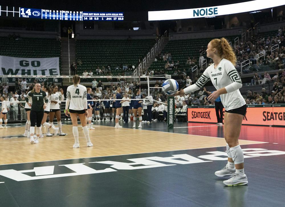 MSU Senior Malayah Long ready to launch the ball, MSU Freshmen Madi Andrews and Senior Lia Schneider speak on the court at the Breslin Center during the MSU v Pennstate Volleyball game In East Lansing, MI on Sunday Sep. 27th, 2026
