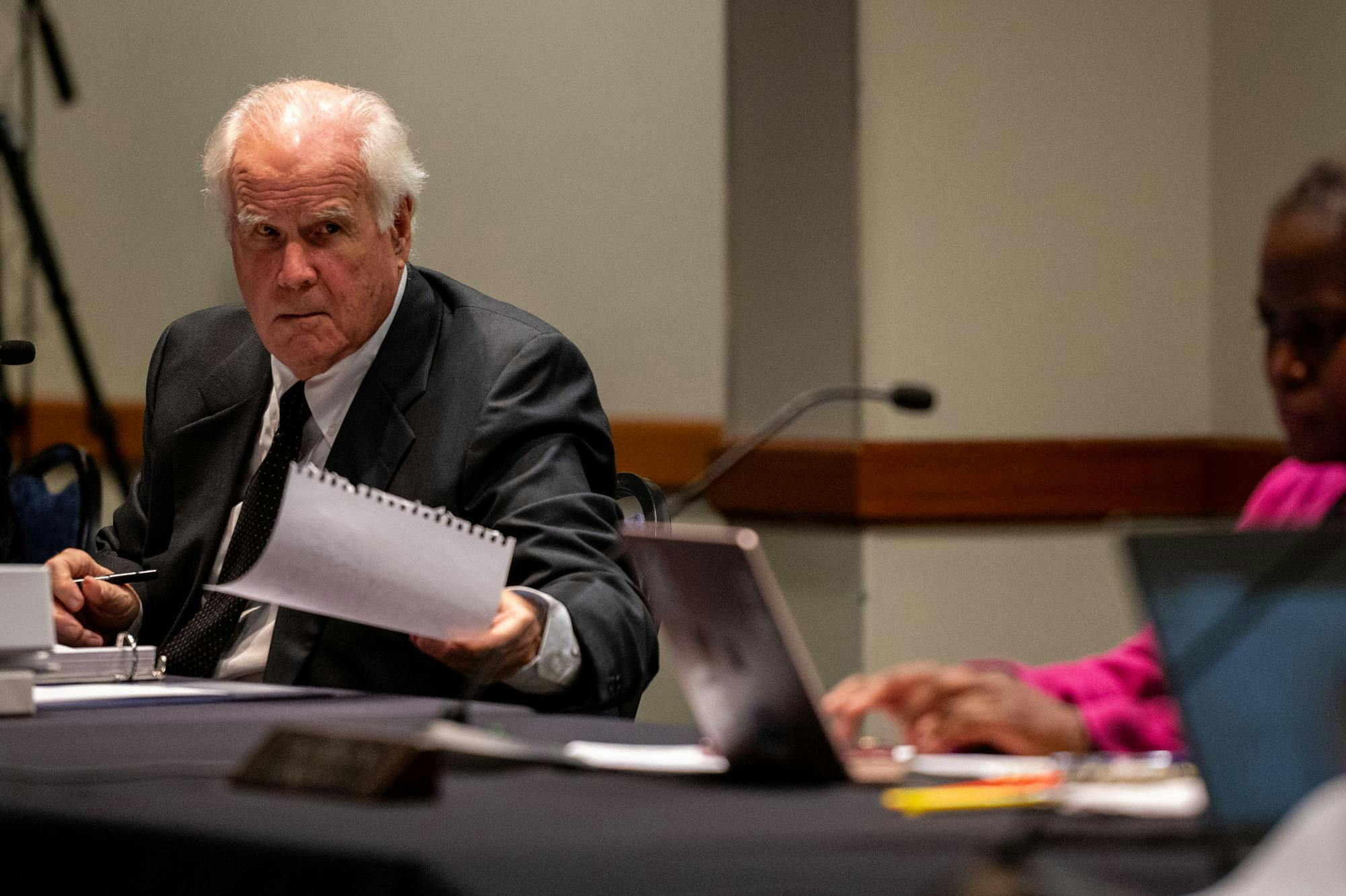 <p>East Lansing Mayor George Brookover, passes a note to Councilmember Dana Watson, during the East Lansing City Council Meeting at the Hannah Community Center in East Lansing, MI, on Tuesday, October, 21, 2025.</p>