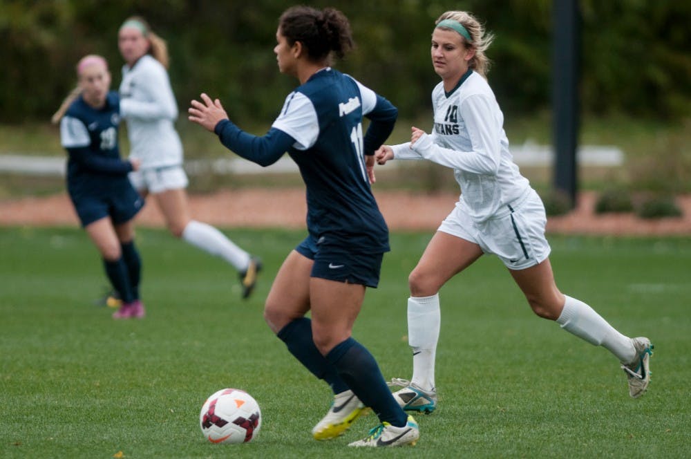 	<p>Penn State forward Raquel Rodriguez runs the ball past junior midfielder Megan Marsack Nov. 1, 2013, at DeMartin Stadium at Old College Field. <span class="caps">MSU</span> lost to Penn State, 3-0. Margaux Forster/The State News</p>