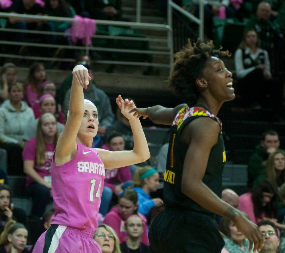 <p>Senior guard Anna Morrissey attempts a 3-pointer guarded by Maryland guard Laurin Mincy Feb. 16, 2015, during the Play4Kay Breast Cancer Awareness game against Maryland at Breslin Center. The Spartans were defeated by the Terrapins, 75-69. Hannah Levy/The State News</p>