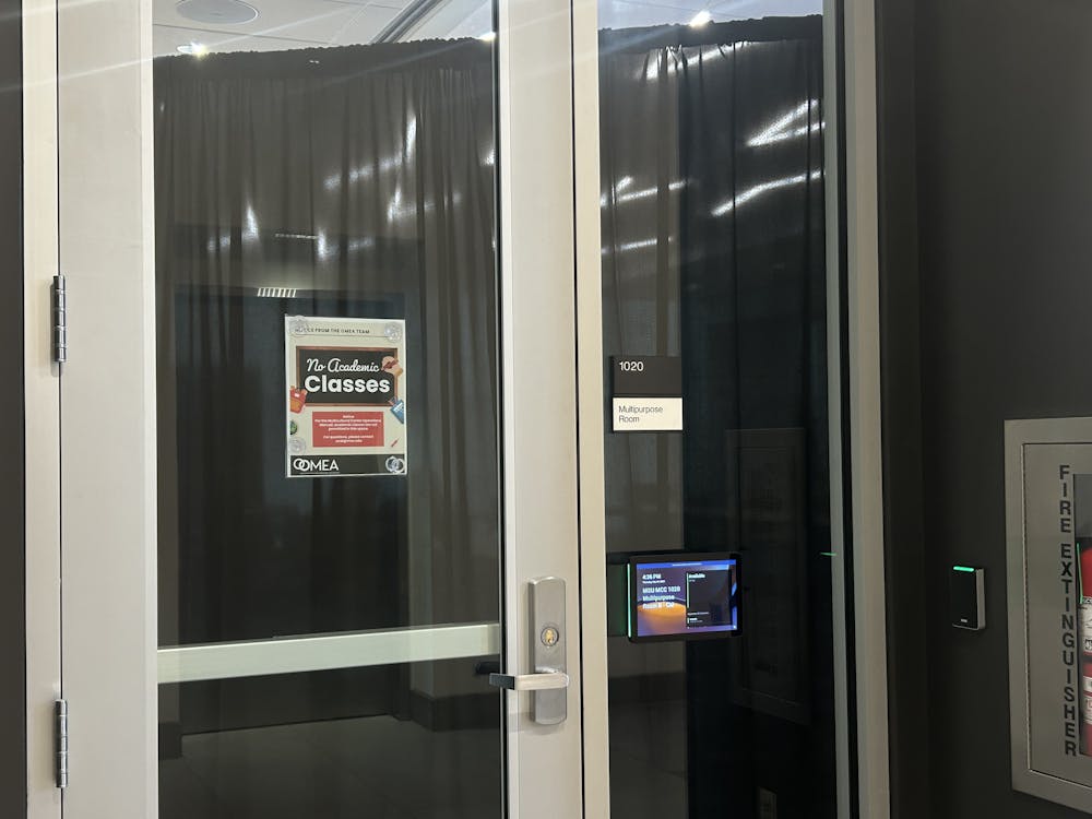 A black curtain obscures any view of the Michigan State University Board of Trustee's September 4, 2025, "stakeholder forum." The private event replaced the board's first public meeting of the school year.