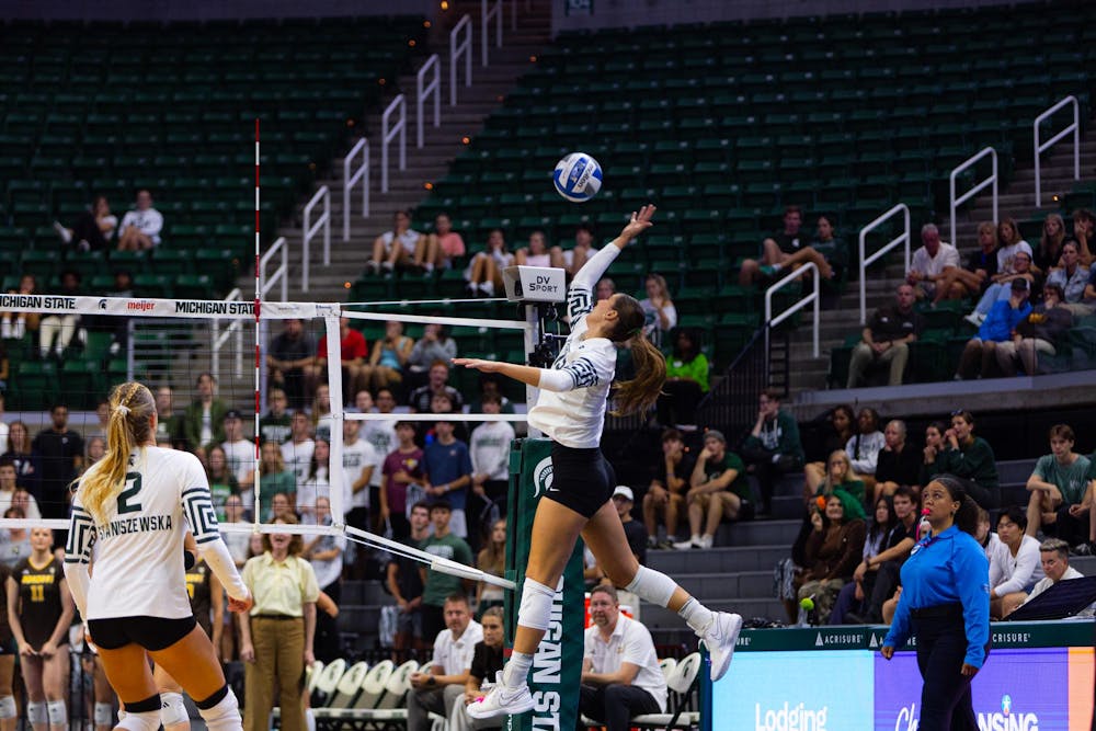 <p>Michigan State junior middle blocker Hayley Ogden (19) hits the ball during the Michigan State vs. Western Michigan volleyball game at the Breslin Center on Tuesday, Sept. 8, 2026.</p>