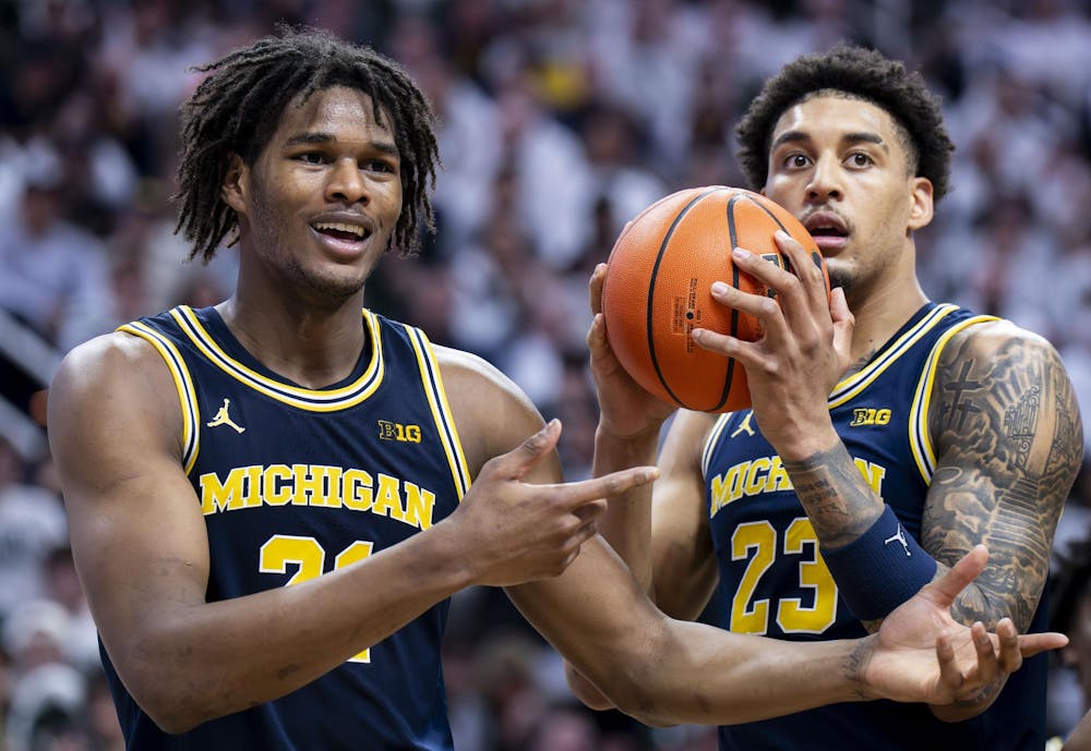<p>UM sophomore forward Morez Johnson Jr. (21) and graduate student forward Yaxel Lendeborg (23)&nbsp;look to the ref after a call is made at the Breslin Student Events Center on Jan. 30, 2026. </p>