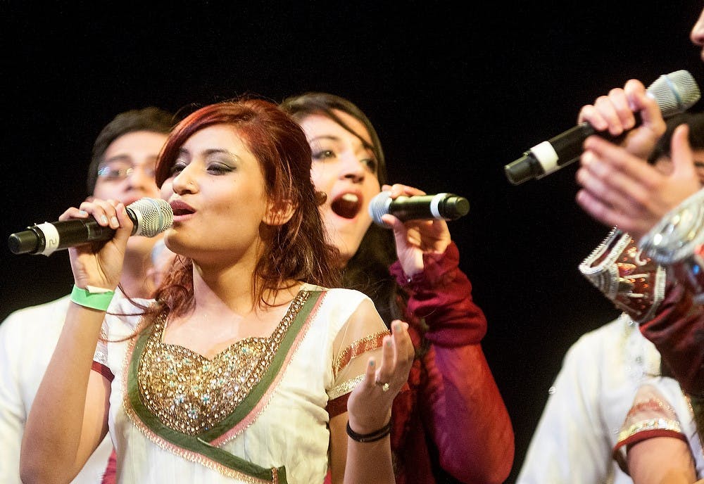 	<p>Marketing sophomore Ronjini Hassan took the stage during the second half of the Spartan Sur&#8217;s performance during the Satrang, an Indian dance show hosted by the <br />
Coalition of Indian Undergraduate Students Saturday, March 23, 2013, at Wharton Center&#8217;s Cobb Great Hall. Hassan sang a solo of Rihanna&#8217;s &#8220;We Found Love&#8221; during the South Asian a capella fusion group&#8217;s performance. Katie Stiefel/The State News</p>