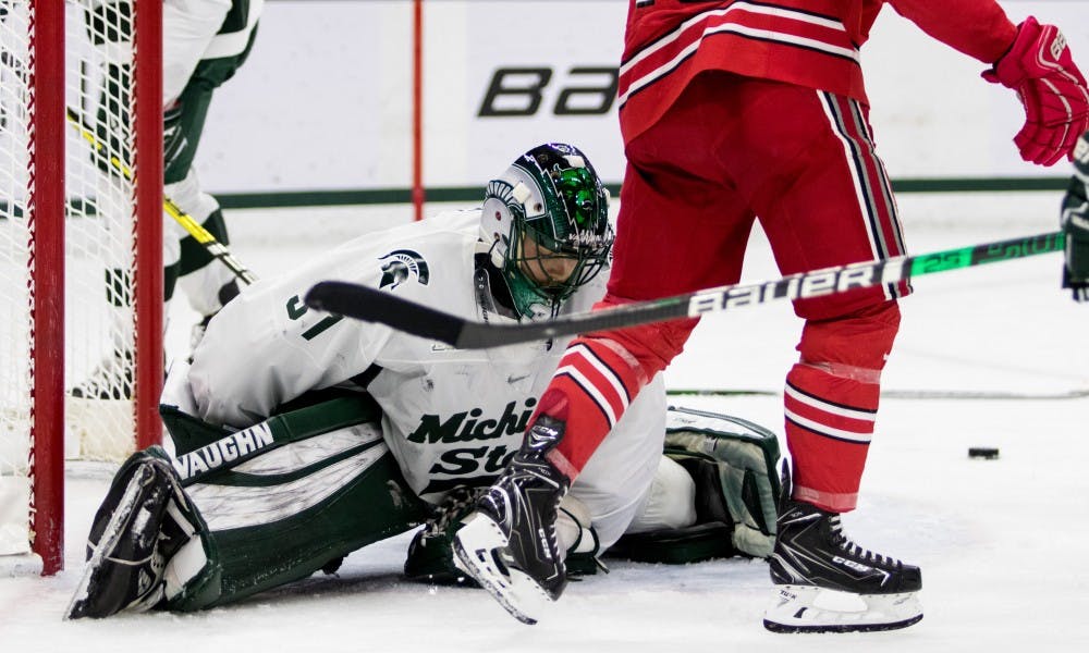 Junior goaltender John Lethemon (31) reacts to letting in a goal during the game against Ohio State University at Munn Ice Arena on Jan. 5, 2019. The Spartans fell to the Buckeyes, 6-0.