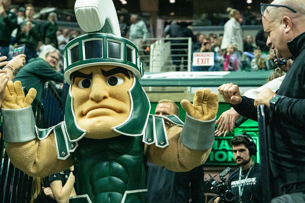 <p>MSU mascot Sparty giving high fives while walking out of the tunnel onto the court before the MSU versus Toledo men's basketball game at the Breslin Center in East Lansing, Michigan on Tuesday, Dec. 16, 2025.</p>