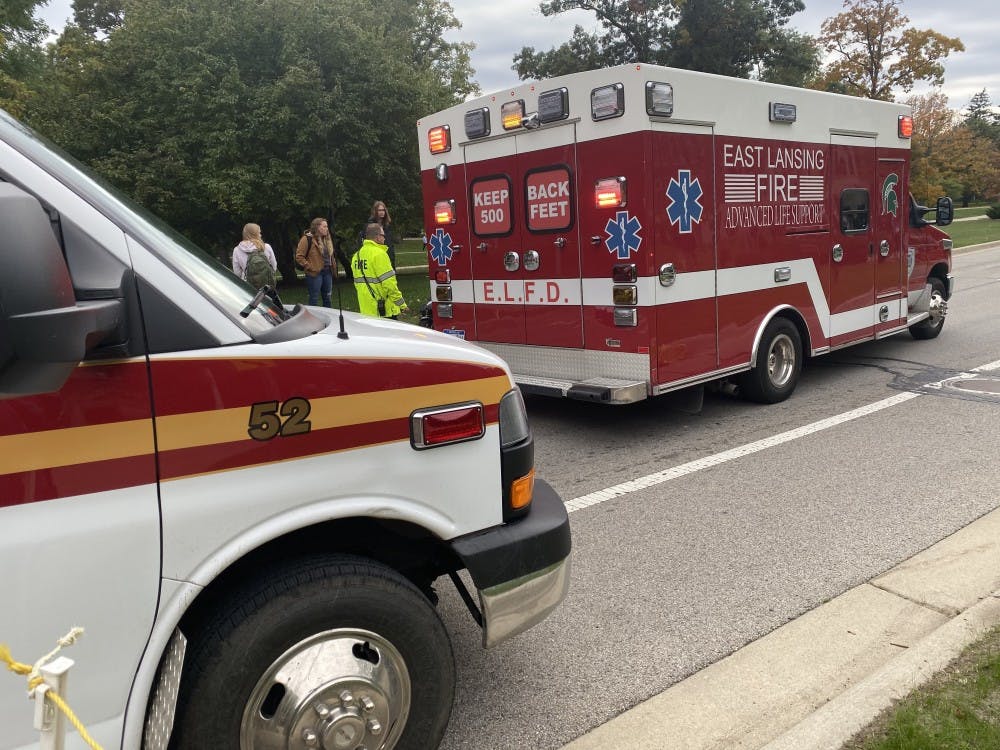 EMTs respond to a moped accident on West Circle Road on Oct. 15, 2019. One female riding a bike collided with one riding a moped.  