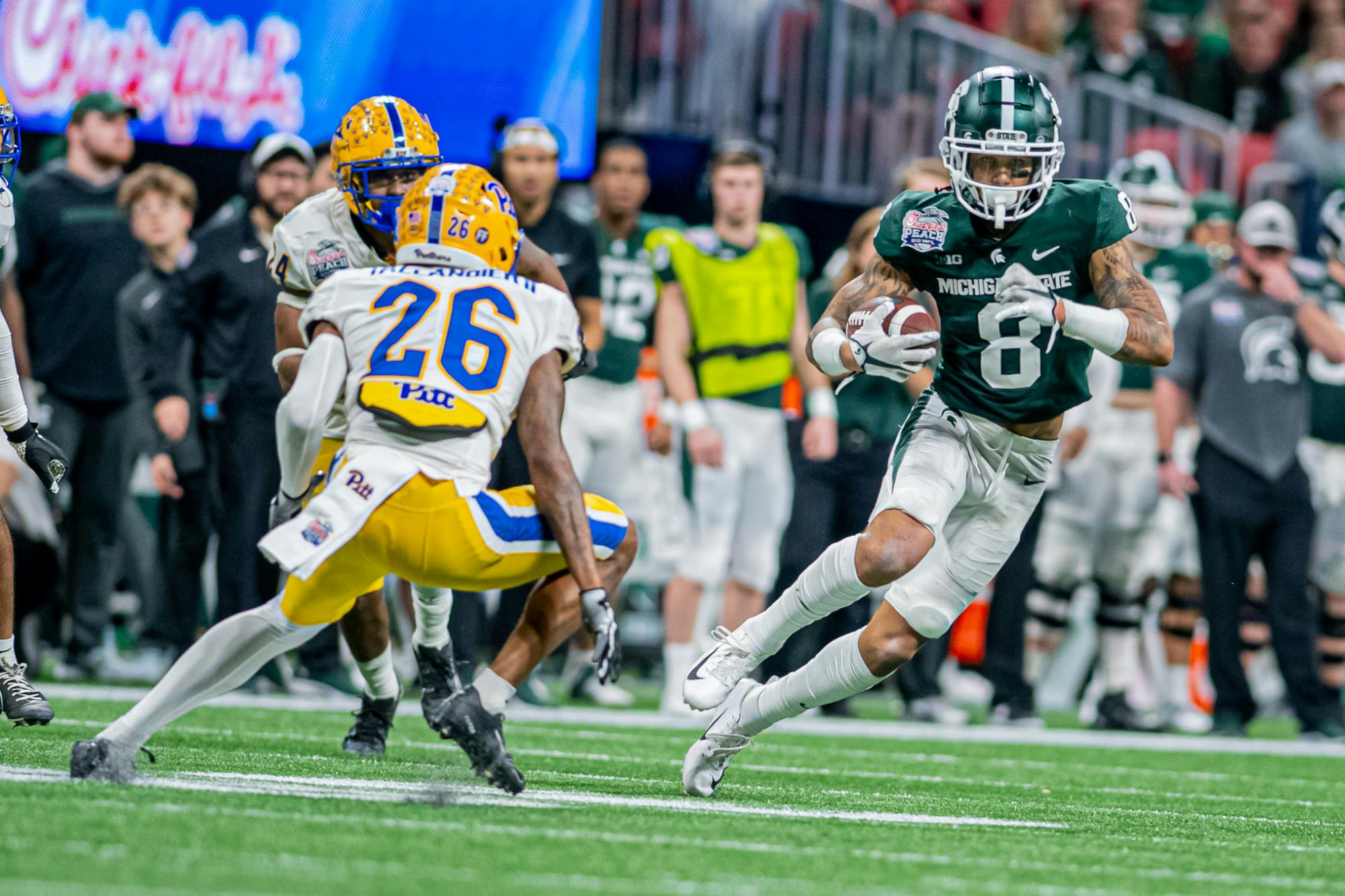 <p>Redshirt junior wide receiver Jalen Nailor cuts away from a defender during the Spartans 31-21 victory against Pitt in the Chick-Fil-A Peach Bowl on Dec. 30, 2021.</p>