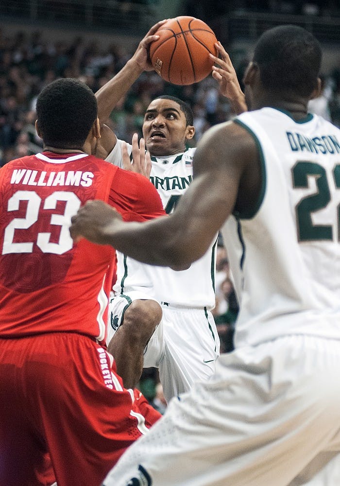 	<p>Freshman guard Gary Harris attempts a layup over Ohio State center Amir Williams on Saturday, Jan. 19, 2013, at Breslin Center. The Spartans defeated the Buckeyes 59-56, improving <span class="caps">MSU</span>&#8217;s record to 5-1 in the Big Ten Conference. Adam Toolin/The State News</p>