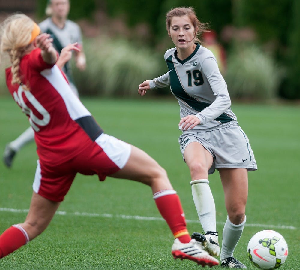 <p>Nebraska midfielder Courtney Claassen tries to steal the ball from sophomore midfielder Marisa Oleksiak during the game against Nebraska on Oct. 5, 2014, at DeMartin Soccer Stadium at Old College Field. The Spartans defeated the Cornhuskers, 3-1. Jessalyn Tamez/The State News</p>