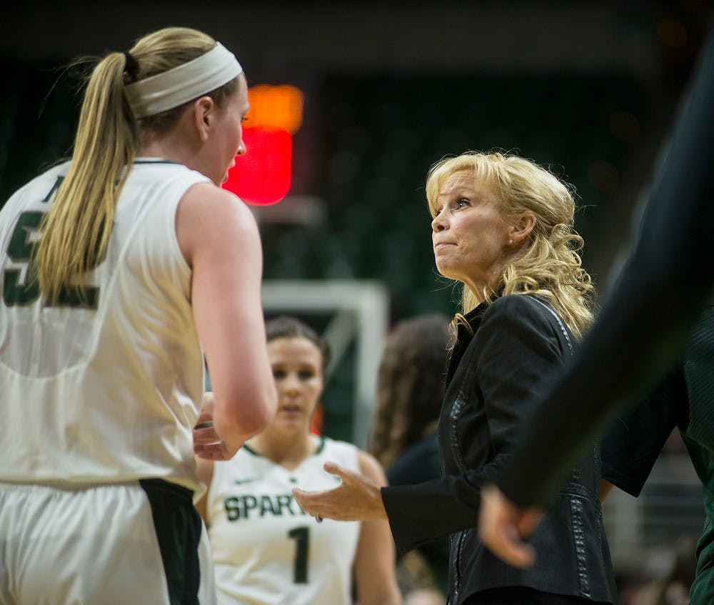 <p>Head coach Suzy Merchant talks with senior forwar Becca Mills before a timeout Jan. 8, 2015, during the game against Nebraska at Breslin Center. The Spartans were defeated by the Huskers, 71-67. Erin Hampton/The State News</p>