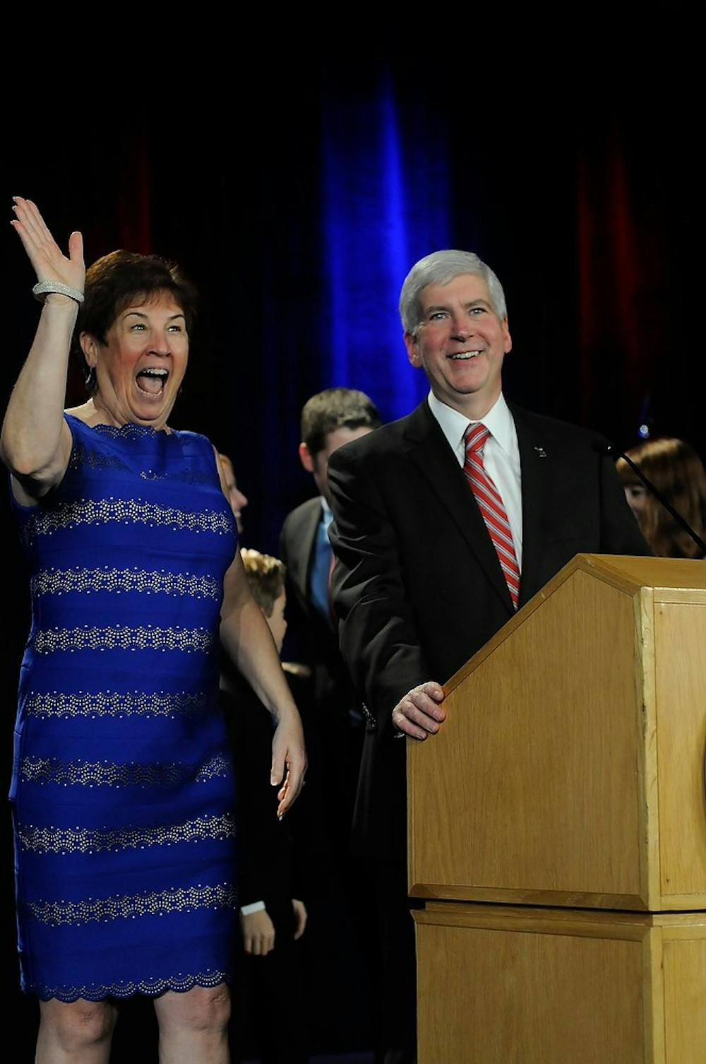 <p>Governor Rick Snyder and wife Sue Snyder celebrate the election win Nov. 4, 2014, at the Detroit Marriott at the Renaissance Center in Detroit, Mich. Jessalyn Tamez/The State News</p>