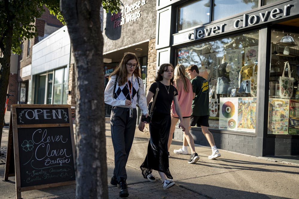 Students and the members of the community walk around downtown East Lansing outside of Clever Clover on Sept. 7, 2022. Fall marks the start of East Lansing businesses seeing more foot-traffic as students return from summer break.