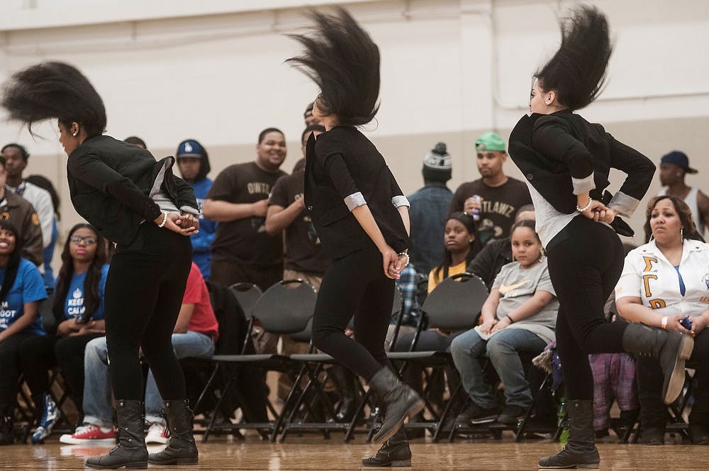 <p>From left to right, chemical engineering senior Lauren Thomas, international relations senior Cydny Henry and nursing senior Vanessa McKenzie perform April 5, 2014, during the Divine Nine Stroll Off at IM Sports-West. The girls performed as members of the Alpha Kappa Alpha sorority. Erin Hampton/The State News</p>