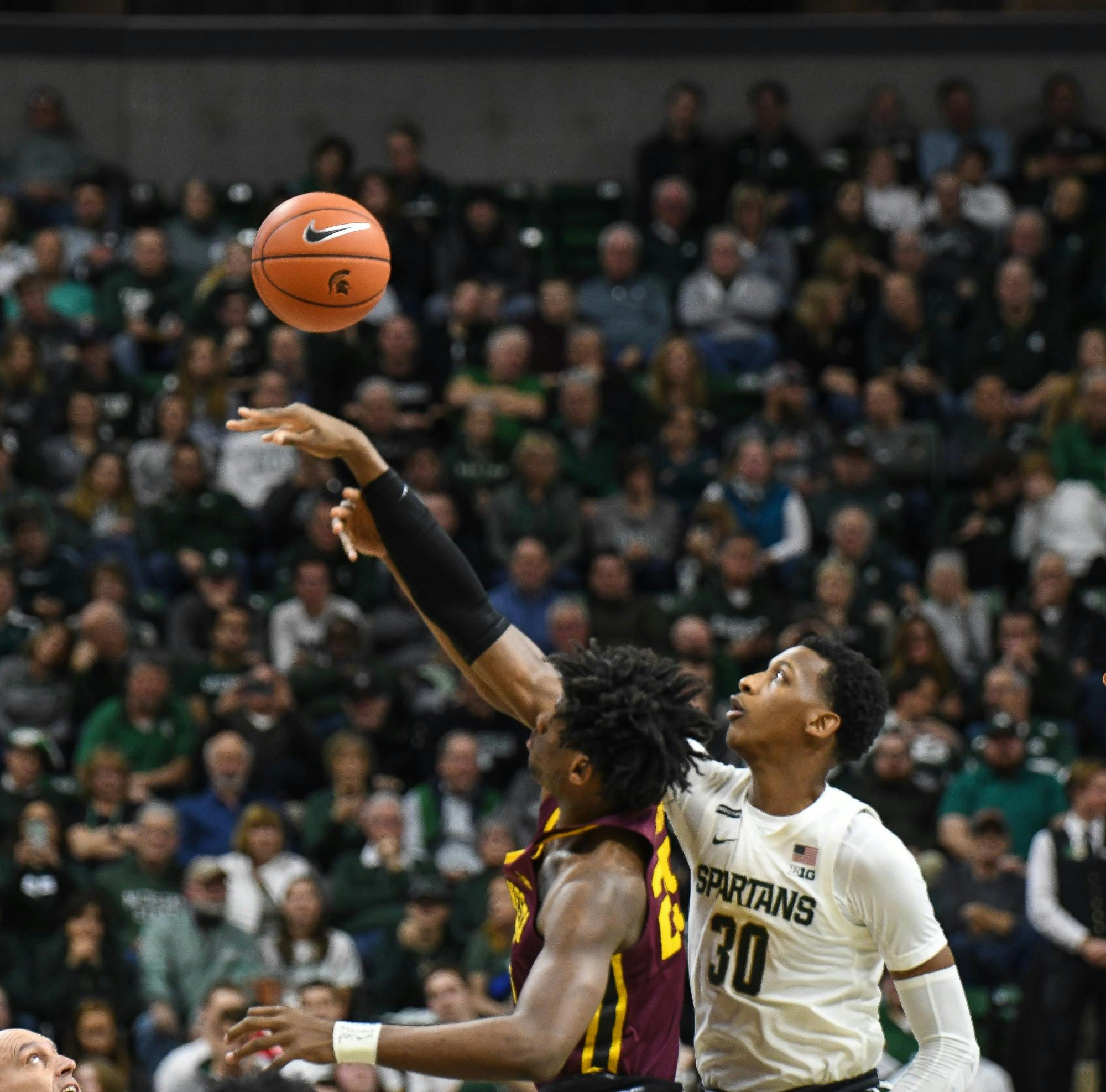 Sophomore forward Marcus Bingham Jr. (30) reaches for the ball during the game against Minnesota at the Breslin Center on January 9, 2020. The Spartans defeated the Golden Gophers 74-58.