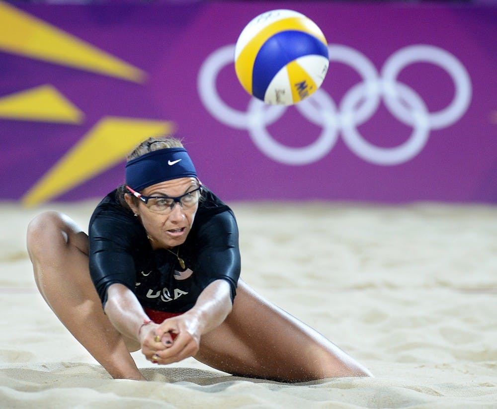 Misty May-Treanor of the United States digs deep to return a ball against an Australia in a preliminary round match at the 2012 Summer Olympics in London, England, on Saturday, July 28, 2012. (Wally Skalij/Los Angeles Times/MCT)