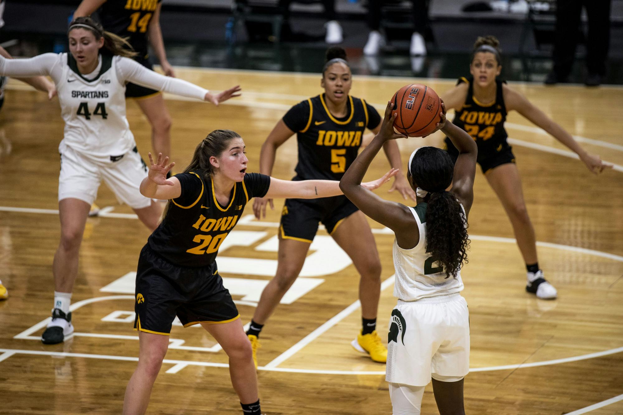 <p>Junior guard Nia Clouden (24) blocked on all sides during a game against Iowa on Dec. 12, 2020 at the Breslin Center. The Spartans defeated the Hawkeyes 86-82.</p>