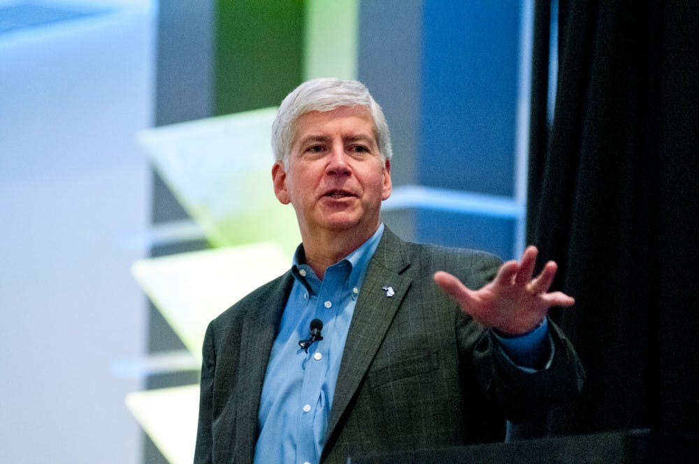 	<p>Gov. Rick Snyder addresses the crowd at the Michigan Partner Solutions Forum on Sept. 18, 2013 at the Kellogg Hotel and Conference Center. Snyder took part as a keynote speaker and took questions from guests. Khoa Nguyen/ The State News</p>