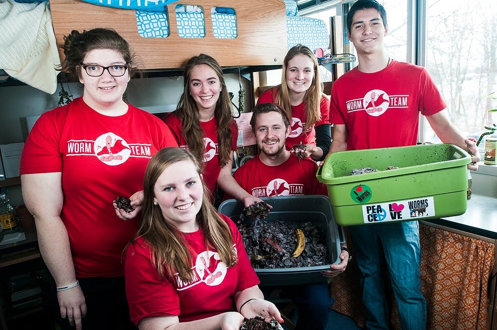 <p>Students of the Residential Initiative on the Study of the Environment Program, also known as RISE, from left, environmental biology and zoology sophomore Leah Strain, crop and soil sciences freshman Emilie Cole, environmental studies and agriscience freshman Leah Desposato, environmental geosciences junior Issac Ross, fisheries and wildlife junior Elizabeth Brajevich, and packaging freshman Jacob Brekke hold bins of worms composting Feb. 26, 2014, in Bailey Hall. The students keep the worms in their dorm rooms and refer to themselves on twitter as the MSU Worms. Erin Hampton/The State News</p>