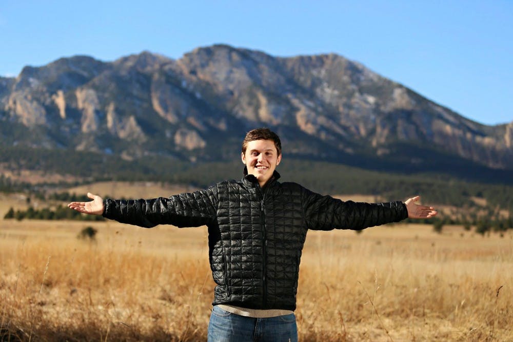 <p>Communications and advertising senior Alex Byers stands in front of the Flatiron Mountains in Boulder, Colorado, in November 2014.</p>