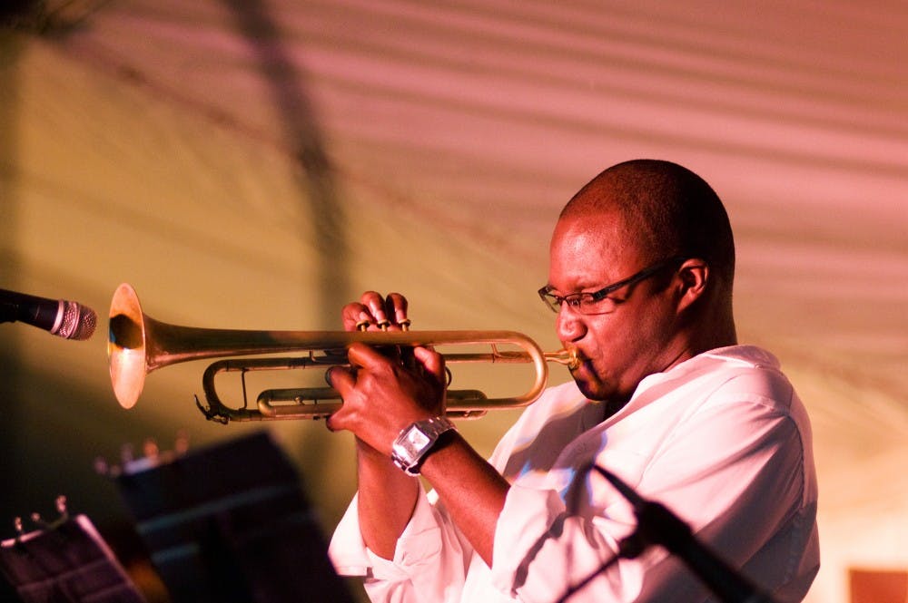 	<p>Keaton Akins of the Evidence jazz group plays a trumpet solo Saturday evening at the Summer Solstice Jazz Festival in downtown East Lansing. Akins and his band from Grand Rapids, Mich. performed in between the main acts all day Saturday. Sam Mikalonis/The State News</p>