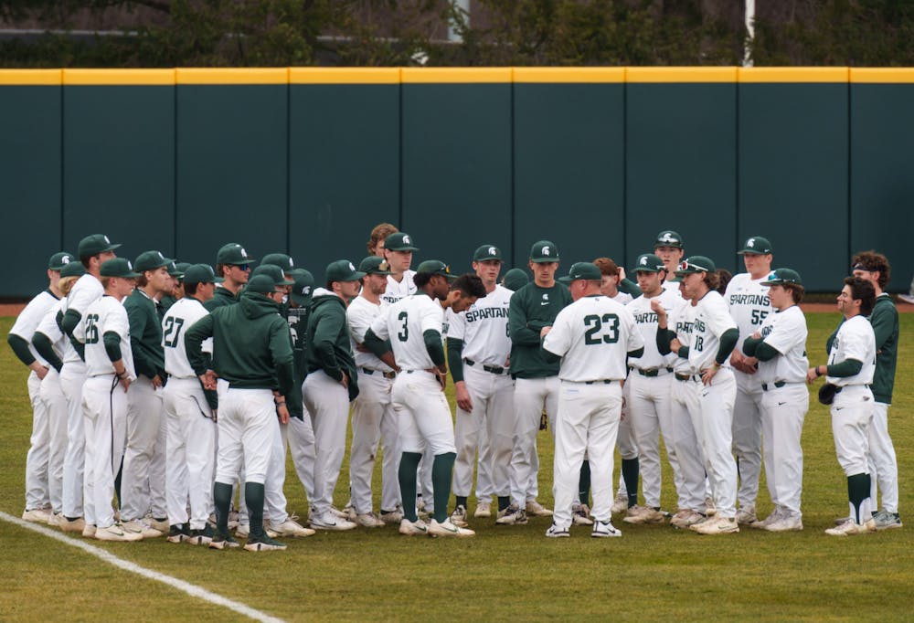 <p>The Michigan State baseball team gathers around before their game against Youngtown State at McLane Baseball Stadium on March 30, 2022. Spartans are victorious 12-5 against Youngtown State.</p>