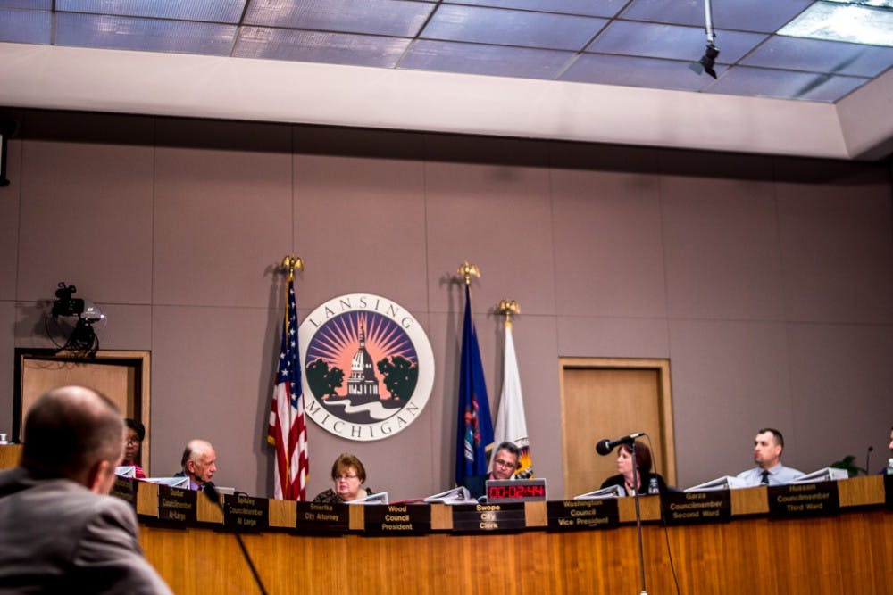 City council members take a moment to deliberate during the city council meeting on March 26, 2018 at the East Lansing City Hall. Residents and pro-marijuana activists gathered to voice their concern over medical marijuana dispensaries being denied operational rights in the city of Lansing. 
