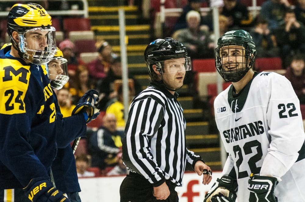 Senior wingman JT Stenglein (22) expresses emotion during the second period of the 52nd Annual Great Lakes Invitational third-place game against the University of Michigan on Dec. 30, 2016 at Joe Louis Arena in Detroit. The Spartans were defeated by the Wolverines in overtime, 5-4.