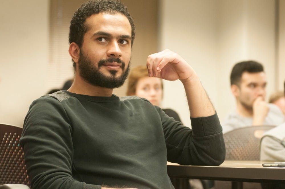 Chemical engineering junior Abdulsalam Alali listens to the speaker on March 27, 2016 at Snyder - Phillips hall. Students came to listen to guest speakers during the first democratic socialist meeting of the year.