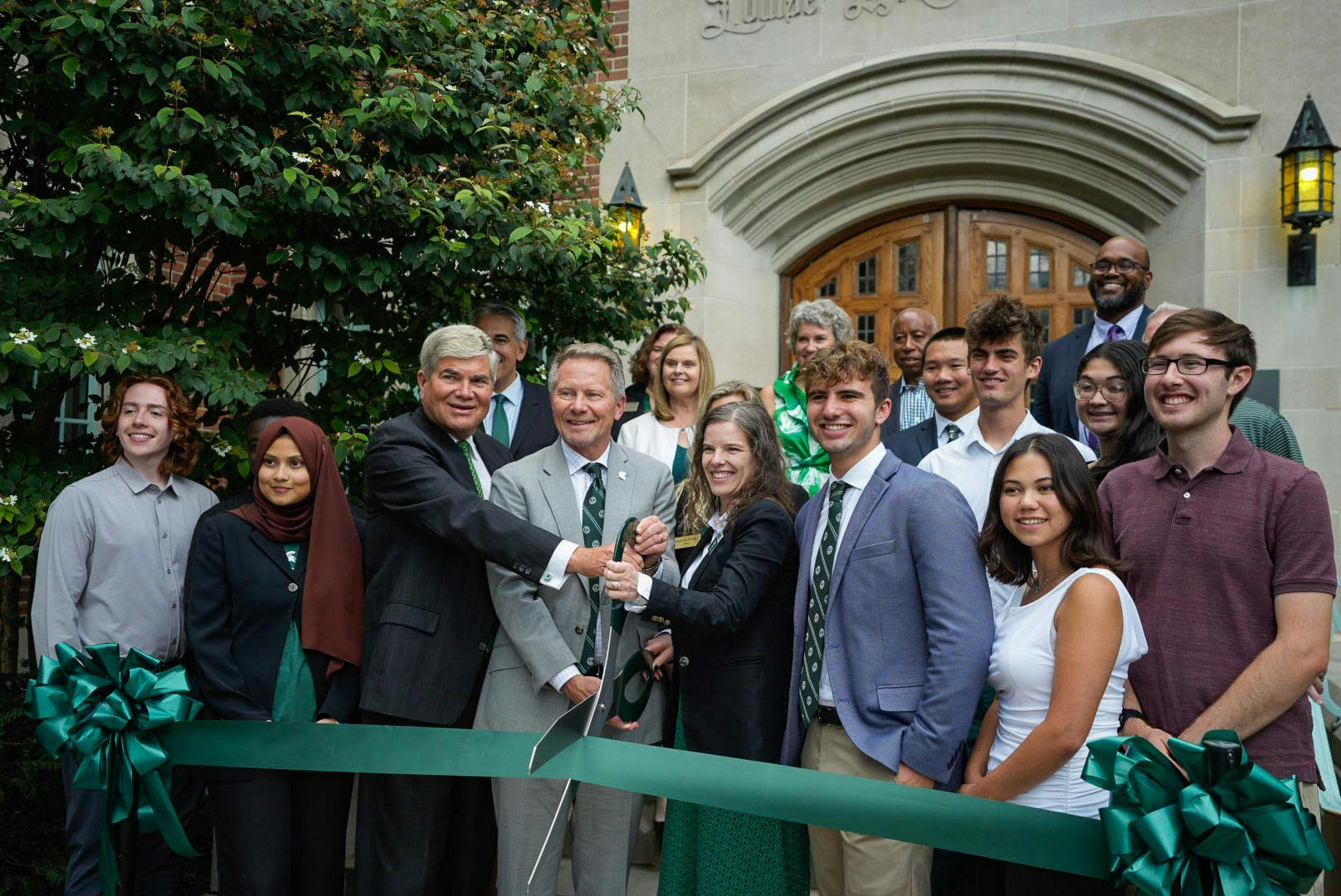 MSU President Kevin Guskiewicz, donor Dave Porteous, faculty and students cut the ribbon at Campbell Hall’s opening ceremony on Michigan State’s campus in East Lansing, Michigan, on Sept. 12, 2025.