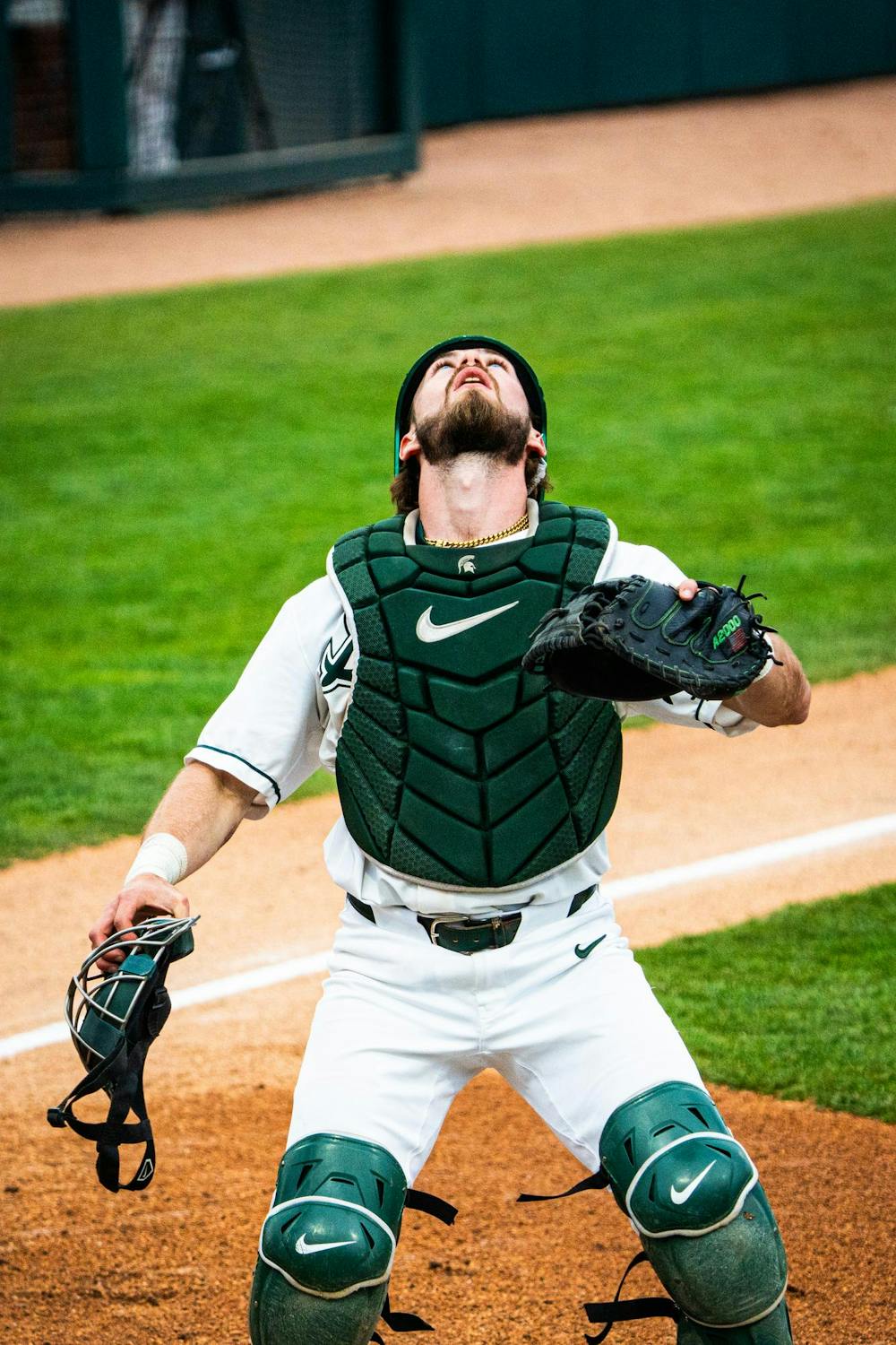 MSU graduate catcher Caleb Berry (31) plants himself under a fly ball during a game at McLane Stadium on April 13, 2025.