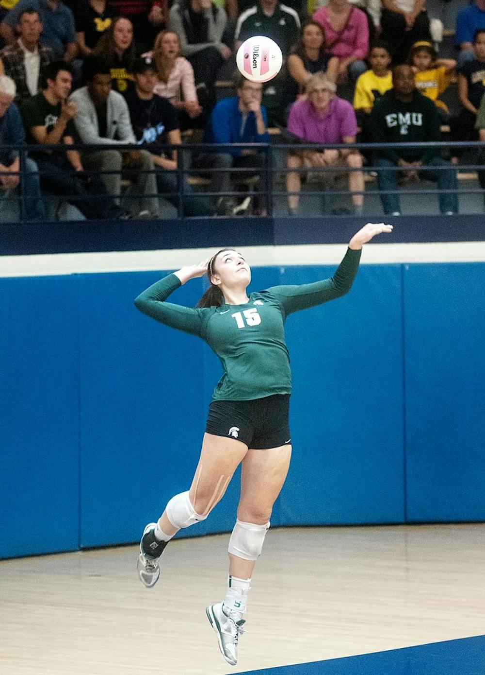 	<p>Junior outside hitter Lauren Wicinski hits a serve Wednesday night, Oct. 17, 2012, at Cliff Keen Arena in Ann Arbor, Mich. The Spartans defeated the Michigan Wolverines in three straight sets (25-20, 25-17, 25-20). Adam Toolin/The State News</p>