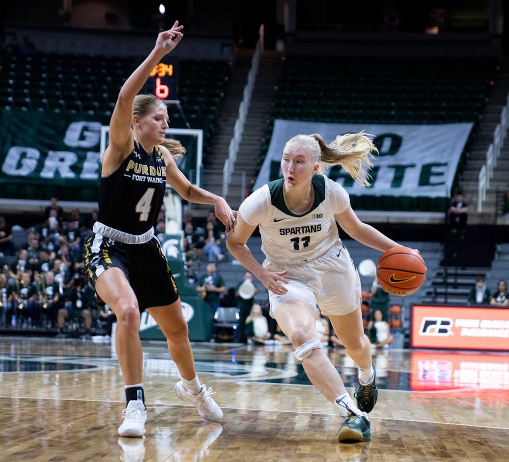 <p>Sophomore guard Matilda Ekh (11) attempts to get past Purdue Fort Wayne players at Breslin Center on Nov. 10, 2022. The Spartans defeated the Mastodons with a score of 85-53.</p>
