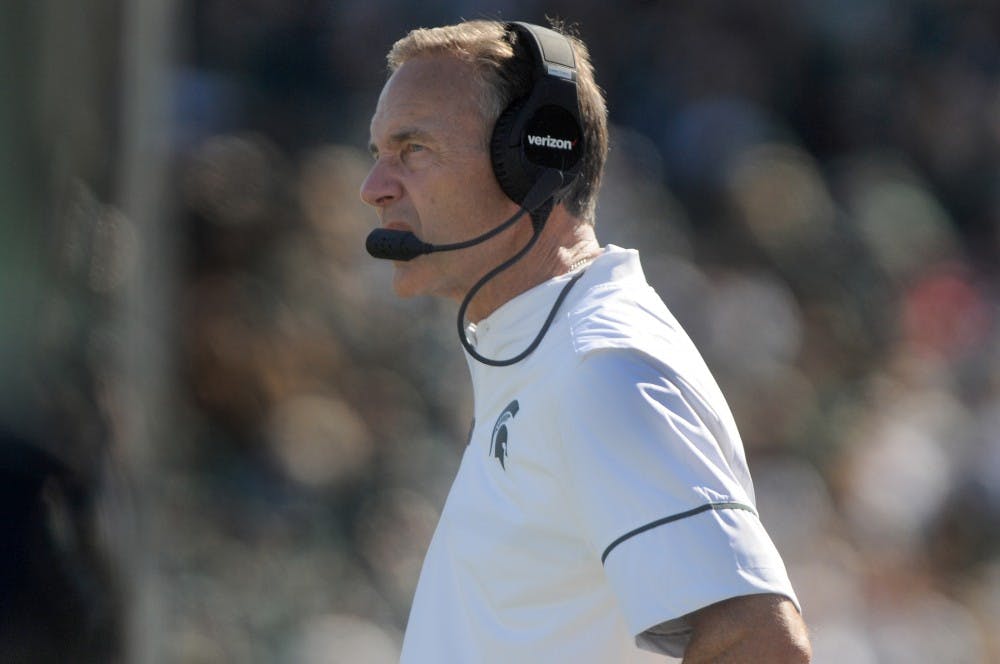 Head coach Mark Dantonio watches the team during the second half of the game against Wisconsin on Sept. 24, 2016 at Spartan Stadium. The Spartans were defeated by the Badgers, 30-6. 
