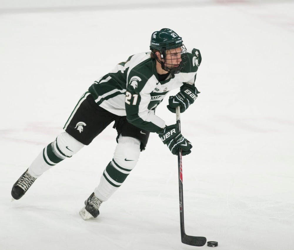 	<p>Freshman forward Joe Cox prepares to pass the puck during a game against Lowell on Oct. 25, 2013, at Munn Ice Arena. The Spartans lost to the River Hawks, 1-4. Georgina De Moya/The State News</p>