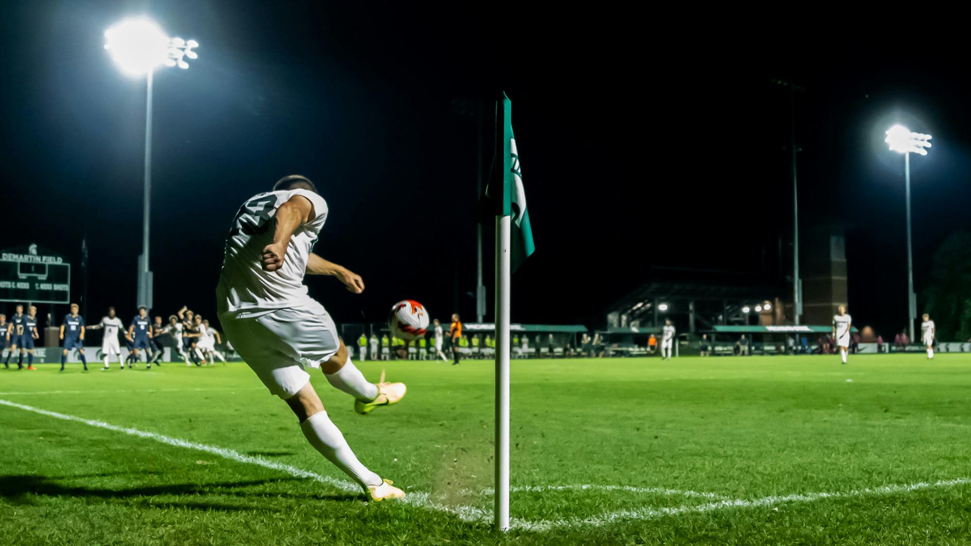 <p>Senior midfielder Louis Sala takes a corner kick during Michigan State&#x27;s loss to Akron on Aug. 30, 2021.</p>