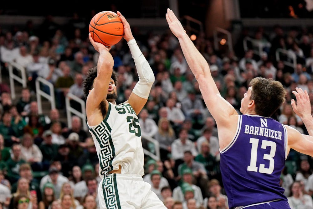 Graduate student forward Malik Hall (25) shoots during a match against Northwestern University at the Breslin Center on March 6, 2024. The Spartans defeated the Wildcats with a score of 53-49. 