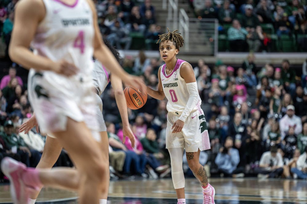 <p>Michigan State University junior guard DeeDee Hagemann (0) gazes down the court deciding her next move at the Breslin Center on Feb. 11, 2024. The Spartans lost to the Buckeyes 71-86.</p>