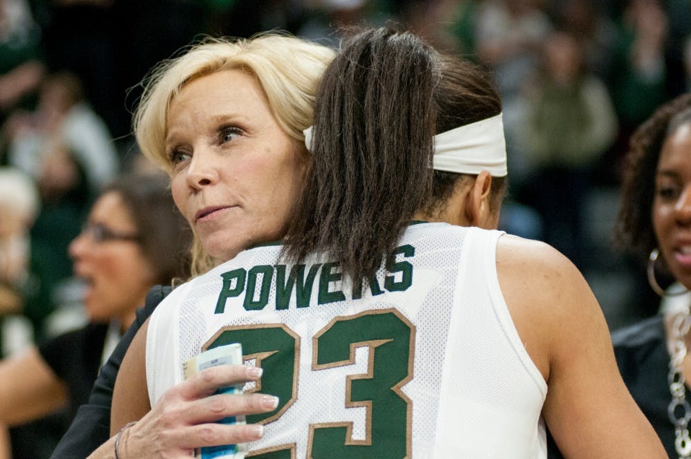 Junior guard Aerial Powers embraces head coach Suzy Merchant after the game against Ohio State on Feb. 27, 2016 at Breslin Center. The Spartans defeated the Buckeyes, 107-105 in triple overtime.