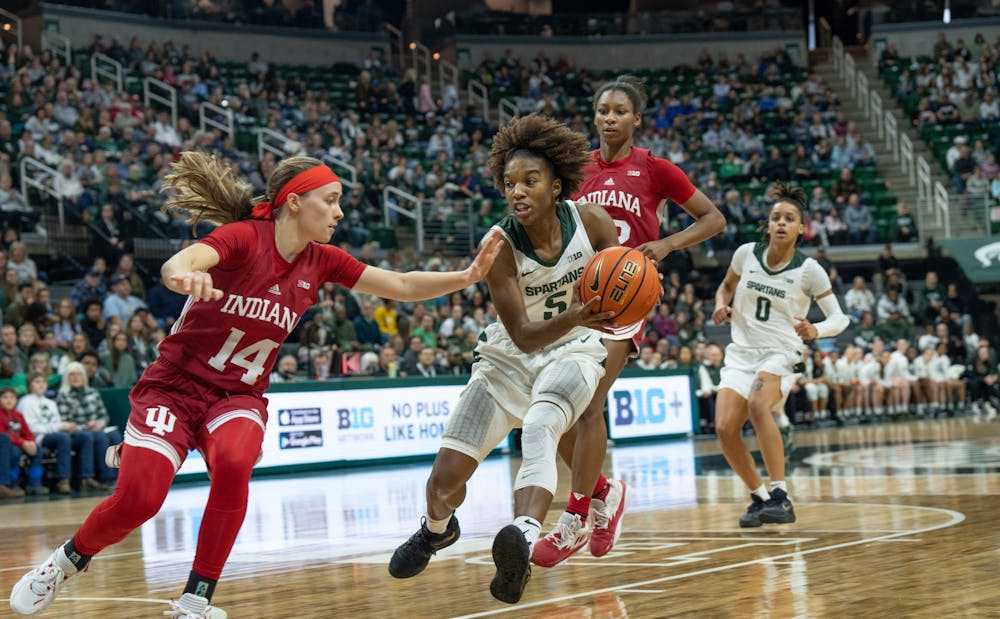 <p>Michigan State&#x27;s Kamaria McDaniel (5) defends the ball against Indiana&#x27;s Sara Scalia (14) during the Spartan&#x27;s victory on Dec. 29, 2022.</p>