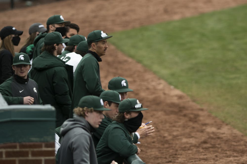 The MSU Baseball Team watches the game from the dugout during the game against Indiana on March 26, 2021, at the McLane Stadium. The Hoosiers defeated the Spartans 8-2.