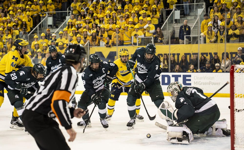 <p>Michigan State junior goalkeeper Trey Augustine (1) blocks the University of Michigan from scoring at the Yost Ice Arena in Ann Arbor, Mich. on Dec. 6, 2025.</p>