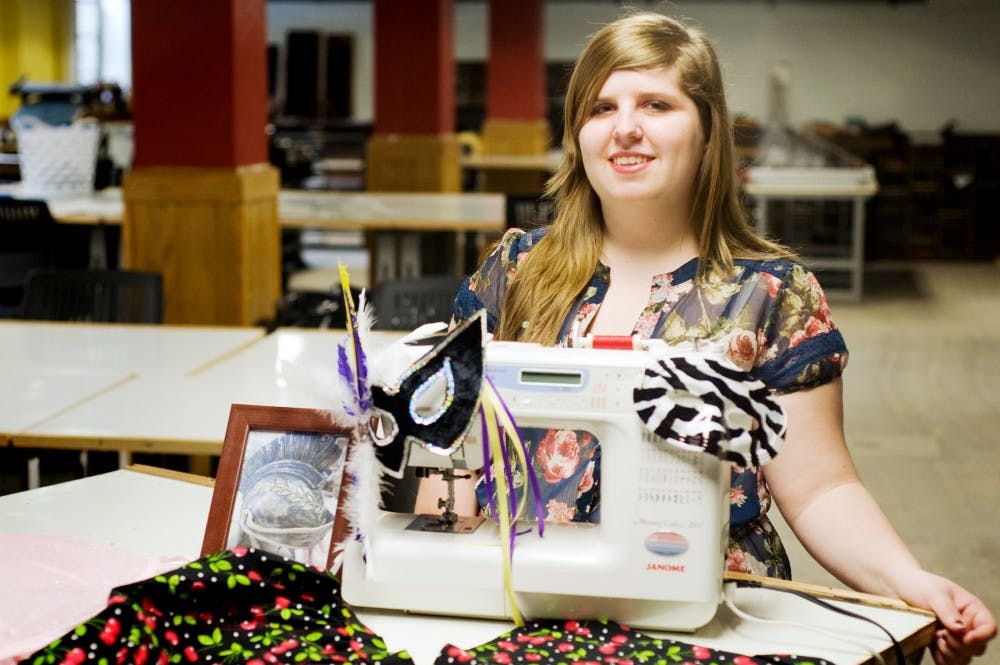 Arts and humanities freshman Sarah Botruff stands for a portrait Tuesday morning at the art studio in the basement of Snyder Hall. Botruff has been sewing since the age of 10, and since than has been sewing for the local community. Justin Wan/The State News