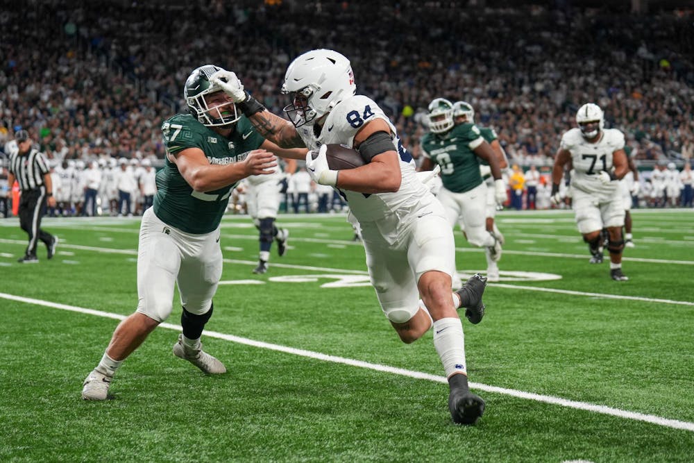 <p>Junior tight end Theo Johnson (84) running the ball during a game between Penn State and Michigan State at Ford Field on Nov. 24, 2023.</p>