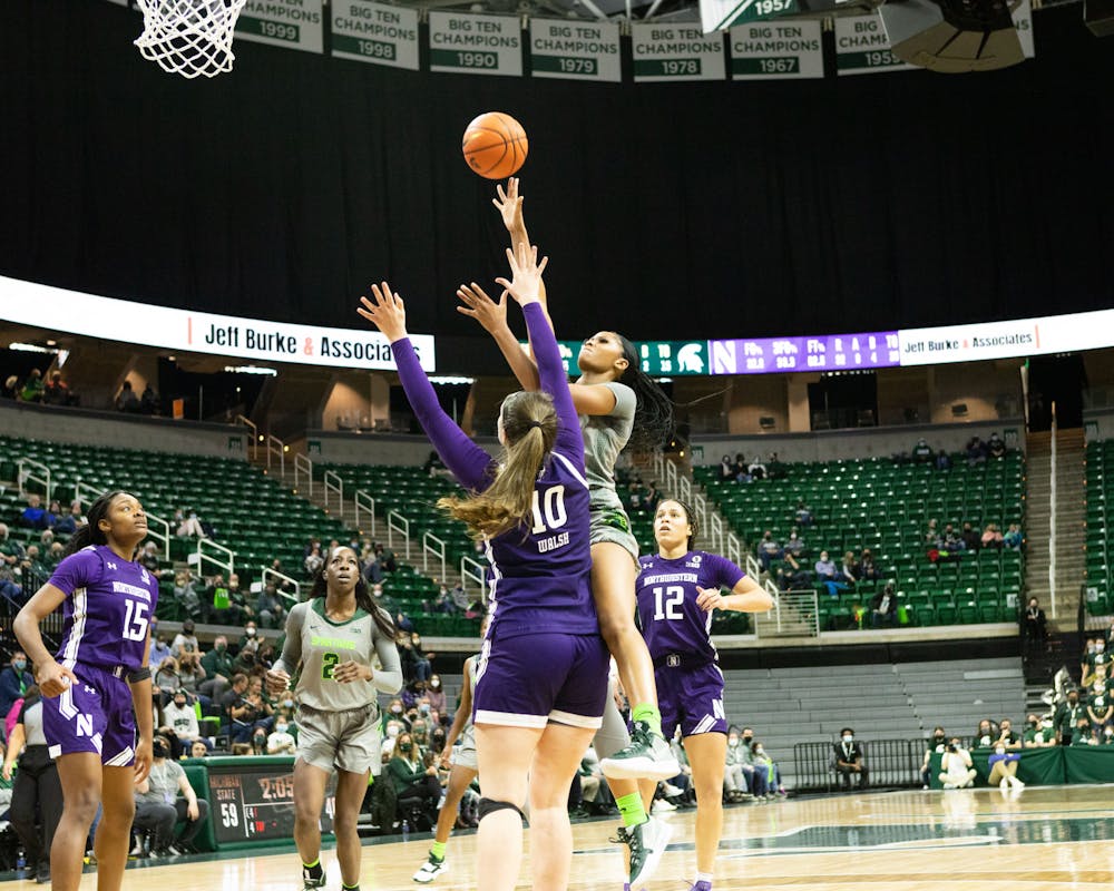 <p>Northwestern Women’s Basketball team attempts to prevent the Michigan State Women’s basketball team from taking a shot.</p>