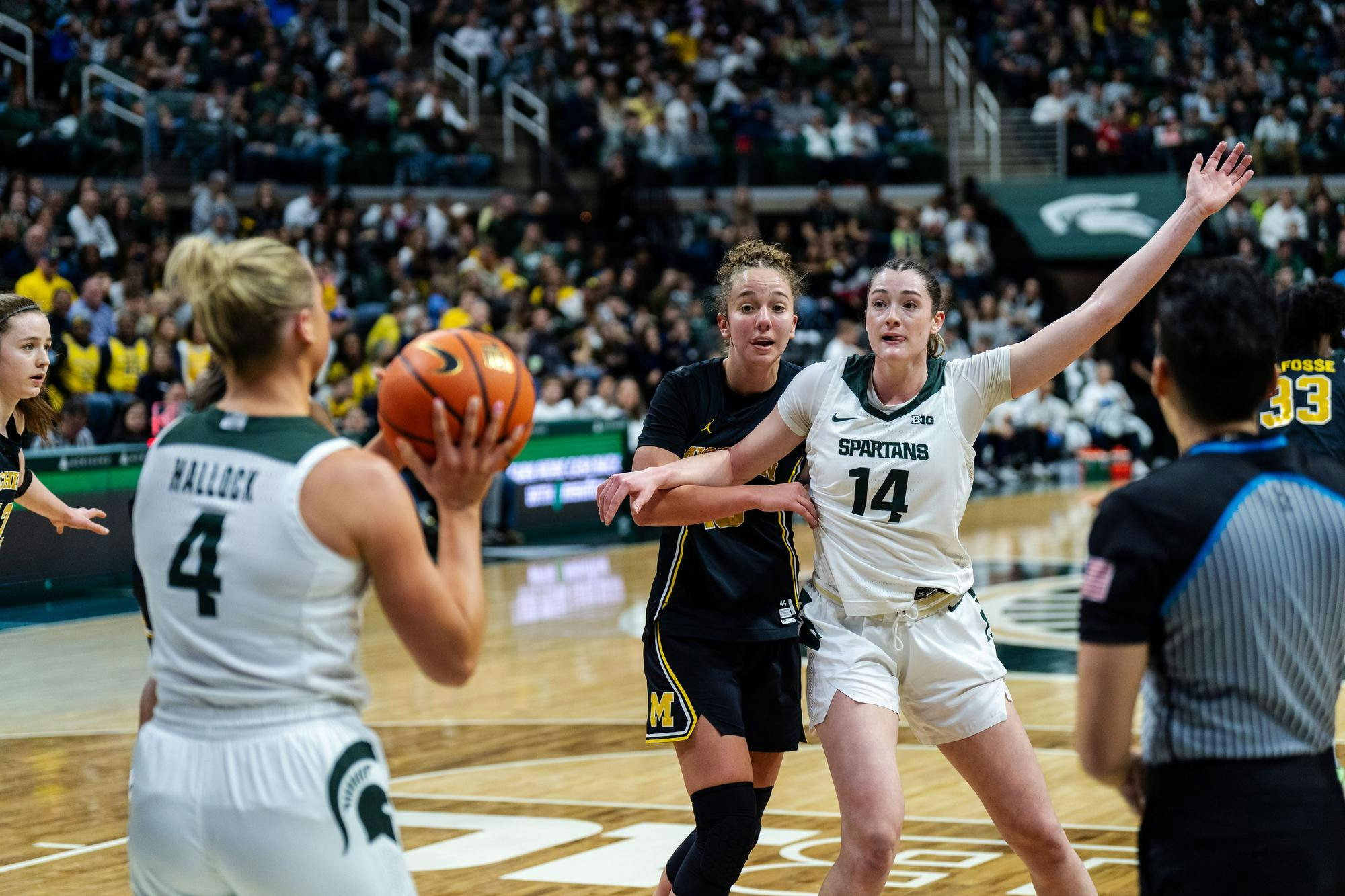 <p>Michigan State junior guard Theryn Hallock (4) passes the ball to junior forward Grace VanSlooten (14) at the Breslin Center on Feb. 9, 2025. Michigan State lost 71-61, falling to 18-5 overall and 8-4 in the Big Ten.</p>