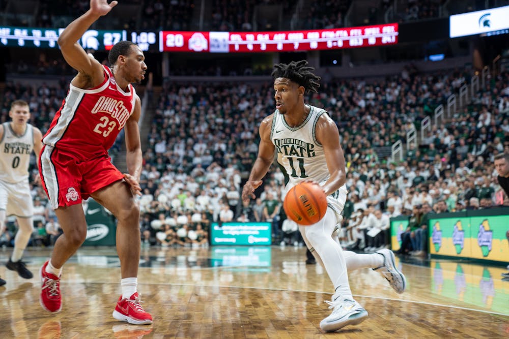 Senior guard A.J. Hoggard (11) driving the ball towards the basket during a game against Ohio State University at the Breslin Student Event Center on Feb. 25, 2024. 