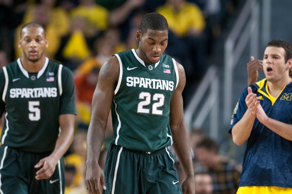 Sophomore guard/forward Branden Dawson, enter, walks towards MSU bench area in the scond half of the game. The Wolverines defeated the Spartans, 58-57, Sunday, March 3, 2013, at Crisler Center in Ann Arbor, Mich. Justin Wan/The State News